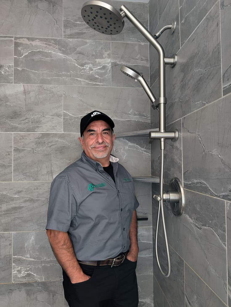 Josue with a Kohler HydroRail shower system installation